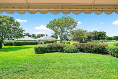 Welcome to this inviting 1st‑floor home showcasing serene on Quail Ridge Golf Course and Country Club in Florida - for sale on GolfHomes.com, golf home, golf lot