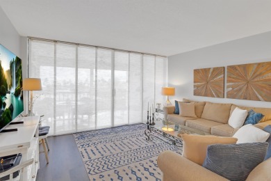 Step into paradise with this beautifully updated 2-bedroom on Ocean Village Golf Course in Florida - for sale on GolfHomes.com, golf home, golf lot