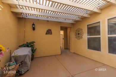 Stone facade adds aesthetic appeal to this 2-BR home plus den on Conestoga Golf Club in Nevada - for sale on GolfHomes.com, golf home, golf lot