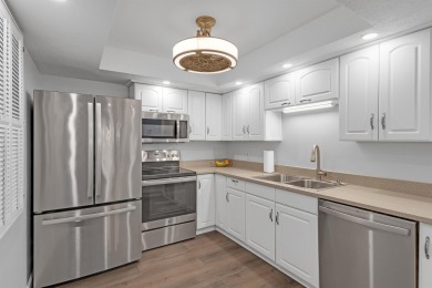 Step into paradise with this beautifully updated 2-bedroom on Ocean Village Golf Course in Florida - for sale on GolfHomes.com, golf home, golf lot