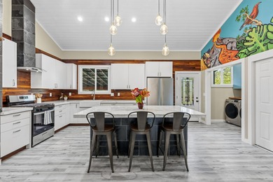 Lovingly built, this newer 3-bedroom, 2-bath custom home is on Volcano Golf and Country Club in Hawaii - for sale on GolfHomes.com, golf home, golf lot