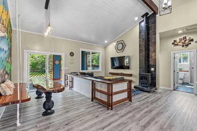 Lovingly built, this newer 3-bedroom, 2-bath custom home is on Volcano Golf and Country Club in Hawaii - for sale on GolfHomes.com, golf home, golf lot