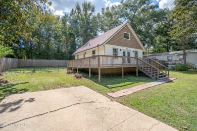 This beautifully updated and recently renovated 3-bedroom on Diamondhead Country Club in Mississippi - for sale on GolfHomes.com, golf home, golf lot