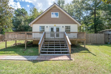 This beautifully updated and recently renovated 3-bedroom on Diamondhead Country Club in Mississippi - for sale on GolfHomes.com, golf home, golf lot