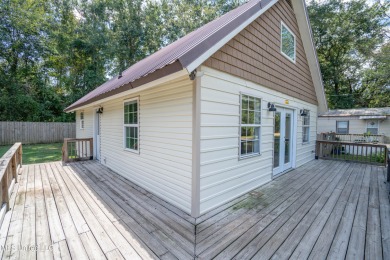 This beautifully updated and recently renovated 3-bedroom on Diamondhead Country Club in Mississippi - for sale on GolfHomes.com, golf home, golf lot