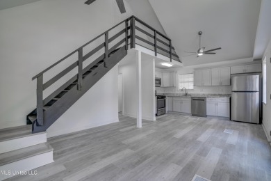 This beautifully updated and recently renovated 3-bedroom on Diamondhead Country Club in Mississippi - for sale on GolfHomes.com, golf home, golf lot