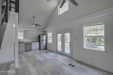 This beautifully updated and recently renovated 3-bedroom on Diamondhead Country Club in Mississippi - for sale on GolfHomes.com, golf home, golf lot