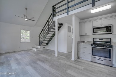 This beautifully updated and recently renovated 3-bedroom on Diamondhead Country Club in Mississippi - for sale on GolfHomes.com, golf home, golf lot