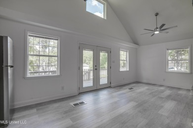 This beautifully updated and recently renovated 3-bedroom on Diamondhead Country Club in Mississippi - for sale on GolfHomes.com, golf home, golf lot