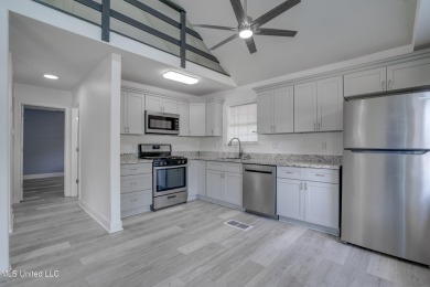 This beautifully updated and recently renovated 3-bedroom on Diamondhead Country Club in Mississippi - for sale on GolfHomes.com, golf home, golf lot