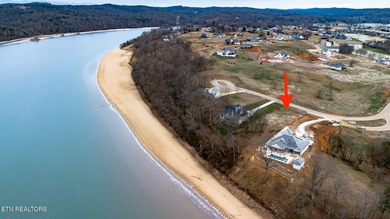 Lot 17 overlooks Watts Bar Lake in the prestigious Tennessee on Tennessee National Golf Club in Tennessee - for sale on GolfHomes.com, golf home, golf lot