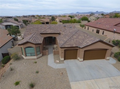 Home is located on a large lot. New interior paint, ceiling fans on Laughlin Ranch Golf Club in Arizona - for sale on GolfHomes.com, golf home, golf lot