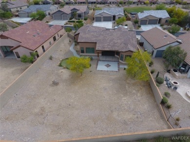 Home is located on a large lot. New interior paint, ceiling fans on Laughlin Ranch Golf Club in Arizona - for sale on GolfHomes.com, golf home, golf lot