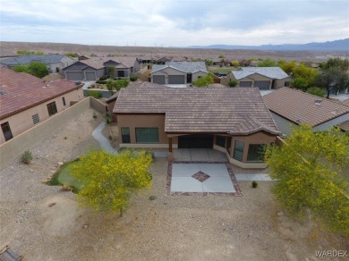 Home is located on a large lot. New interior paint, ceiling fans on Laughlin Ranch Golf Club in Arizona - for sale on GolfHomes.com, golf home, golf lot