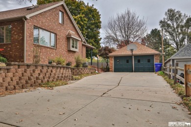 Experience the perfect blend of modern elegance and classic on Syracuse Golf Course in Nebraska - for sale on GolfHomes.com, golf home, golf lot