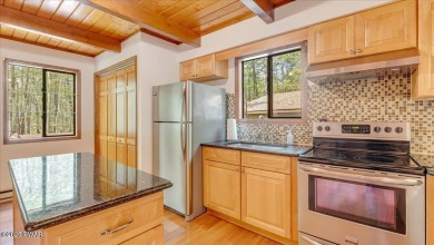 Nestled in the desirable Tanglwood Lakes community, this on Paupack Hills Golf and Country Club in Pennsylvania - for sale on GolfHomes.com, golf home, golf lot