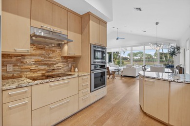 Discover refined single-story living in the prestigious Whisper on Broken Sound Golf and Club  in Florida - for sale on GolfHomes.com, golf home, golf lot