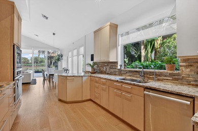 Discover refined single-story living in the prestigious Whisper on Broken Sound Golf and Club  in Florida - for sale on GolfHomes.com, golf home, golf lot