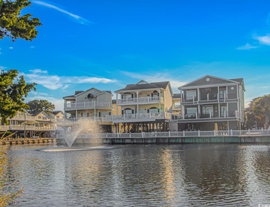 This LAKE FRONT 5 bedroom 3.5  bath raised beach house with on Prestwick Country Club in South Carolina - for sale on GolfHomes.com, golf home, golf lot