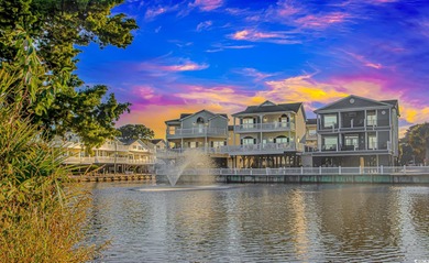 This LAKE FRONT 5 bedroom 3.5  bath raised beach house with on Prestwick Country Club in South Carolina - for sale on GolfHomes.com, golf home, golf lot