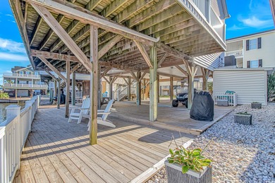 This LAKE FRONT 5 bedroom 3.5  bath raised beach house with on Prestwick Country Club in South Carolina - for sale on GolfHomes.com, golf home, golf lot