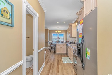 This LAKE FRONT 5 bedroom 3.5  bath raised beach house with on Prestwick Country Club in South Carolina - for sale on GolfHomes.com, golf home, golf lot