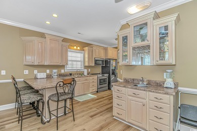 This LAKE FRONT 5 bedroom 3.5  bath raised beach house with on Prestwick Country Club in South Carolina - for sale on GolfHomes.com, golf home, golf lot