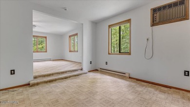Nestled in the desirable Tanglwood Lakes community, this on Paupack Hills Golf and Country Club in Pennsylvania - for sale on GolfHomes.com, golf home, golf lot