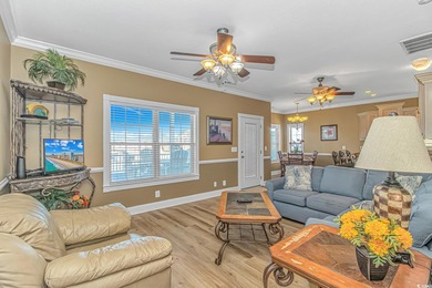 This LAKE FRONT 5 bedroom 3.5  bath raised beach house with on Prestwick Country Club in South Carolina - for sale on GolfHomes.com, golf home, golf lot