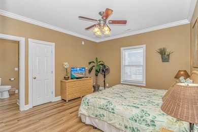 This LAKE FRONT 5 bedroom 3.5  bath raised beach house with on Prestwick Country Club in South Carolina - for sale on GolfHomes.com, golf home, golf lot