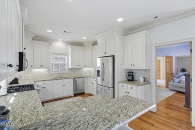 Welcome home to this charming 3-bedroom, 2-bath residence in the on Lake Caroline Golf Club in Mississippi - for sale on GolfHomes.com, golf home, golf lot