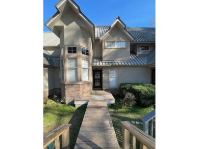 Situated along the waters edge in the prestigious neighborhood on Red Eagle Golf Course in Alabama - for sale on GolfHomes.com, golf home, golf lot