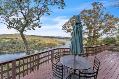 This home boasts a view like few others can perched high on a on Holiday Island Executive Golf Course in Arkansas - for sale on GolfHomes.com, golf home, golf lot