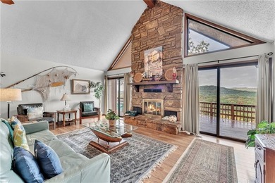 This home boasts a view like few others can perched high on a on Holiday Island Executive Golf Course in Arkansas - for sale on GolfHomes.com, golf home, golf lot