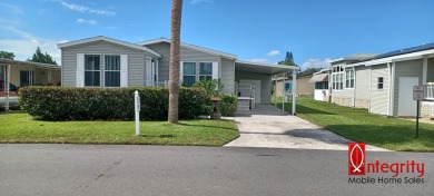 Come settle down and relax in a beautiful manufactured home with on Fairways Country Club in Florida - for sale on GolfHomes.com, golf home, golf lot