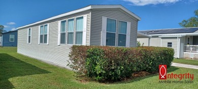 Come settle down and relax in a beautiful manufactured home with on Fairways Country Club in Florida - for sale on GolfHomes.com, golf home, golf lot