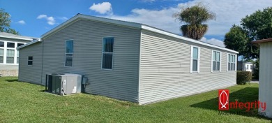 Come settle down and relax in a beautiful manufactured home with on Fairways Country Club in Florida - for sale on GolfHomes.com, golf home, golf lot