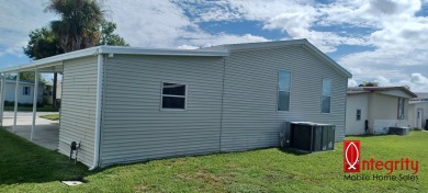 Come settle down and relax in a beautiful manufactured home with on Fairways Country Club in Florida - for sale on GolfHomes.com, golf home, golf lot