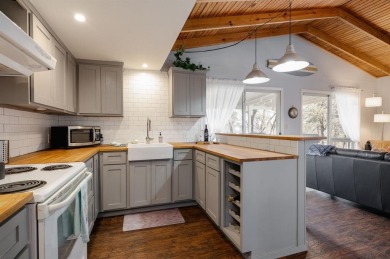 Nestled in a peaceful, wooded setting, this charming 3-bedroom on Tanglewood Resort in Texas - for sale on GolfHomes.com, golf home, golf lot