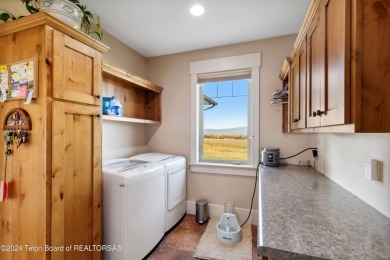 This exceptional 5-bedroom, 3-bath home, built by the renowned on Star Valley RV Golf Course in Wyoming - for sale on GolfHomes.com, golf home, golf lot