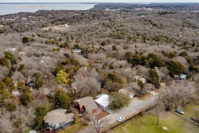 Nestled in a peaceful, wooded setting, this charming 3-bedroom on Tanglewood Resort in Texas - for sale on GolfHomes.com, golf home, golf lot