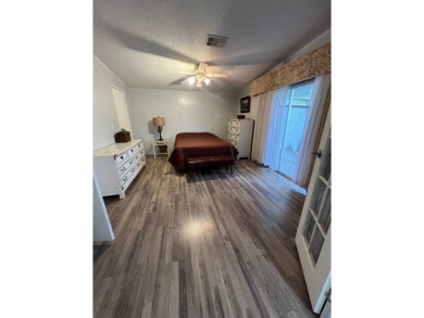 MOTIVATED SELLER! Tucked away in a peaceful Winter Haven 55+ on Lake Henry Golf Club in Florida - for sale on GolfHomes.com, golf home, golf lot