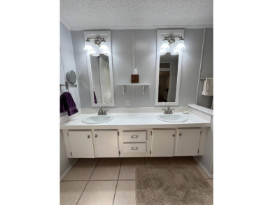 MOTIVATED SELLER! Tucked away in a peaceful Winter Haven 55+ on Lake Henry Golf Club in Florida - for sale on GolfHomes.com, golf home, golf lot
