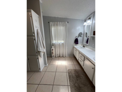 MOTIVATED SELLER! Tucked away in a peaceful Winter Haven 55+ on Lake Henry Golf Club in Florida - for sale on GolfHomes.com, golf home, golf lot