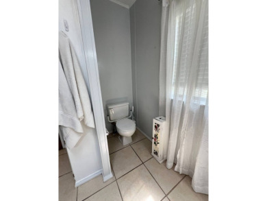 MOTIVATED SELLER! Tucked away in a peaceful Winter Haven 55+ on Lake Henry Golf Club in Florida - for sale on GolfHomes.com, golf home, golf lot