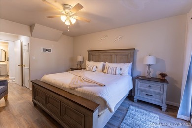 Discover lake living at its finest in the iconic Tan-Tar-A on The Oaks Golf Course in Missouri - for sale on GolfHomes.com, golf home, golf lot