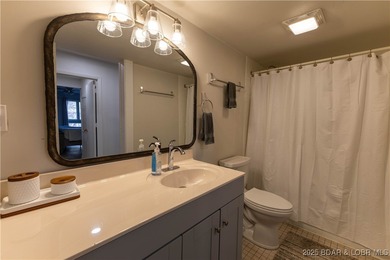 Discover lake living at its finest in the iconic Tan-Tar-A on The Oaks Golf Course in Missouri - for sale on GolfHomes.com, golf home, golf lot