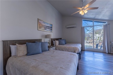 Discover lake living at its finest in the iconic Tan-Tar-A on The Oaks Golf Course in Missouri - for sale on GolfHomes.com, golf home, golf lot