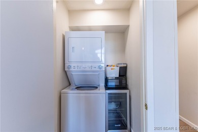 Discover lake living at its finest in the iconic Tan-Tar-A on The Oaks Golf Course in Missouri - for sale on GolfHomes.com, golf home, golf lot