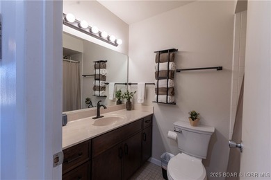 Discover lake living at its finest in the iconic Tan-Tar-A on The Oaks Golf Course in Missouri - for sale on GolfHomes.com, golf home, golf lot